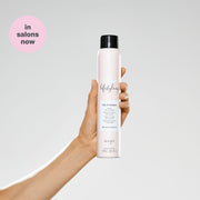 milk-shake-lifestyling-dry-shampoo-in-hand